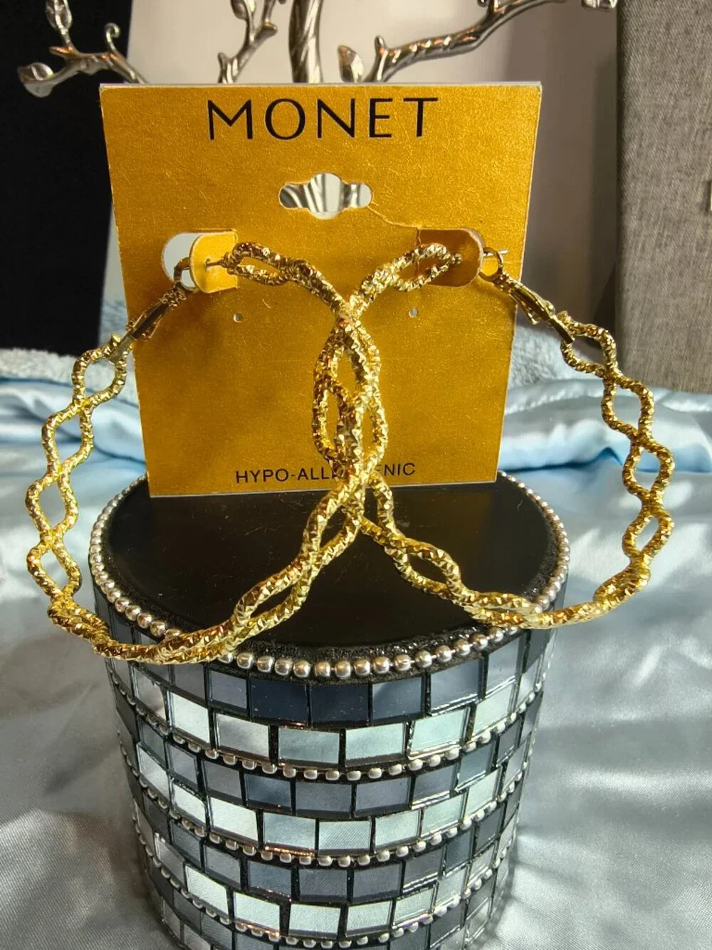 Monet Gold Tone Criss Cross Hoop earrings